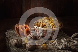 Raisins in a basket and other fruits