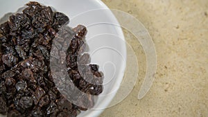 raisins on white plate, ingredient of & x22;chile en nogada& x22;, typical dish of gastronomy in puebla, Mexico photo