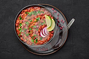 Rajma Masala Curry in black bowl on dark slate table top. Red Kidney Bean Dal is indian cuisine vegetarian dish