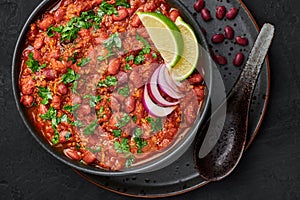 Rajma Masala Curry in black bowl on dark slate table top. Red Kidney Bean Dal is indian cuisine vegetarian dish