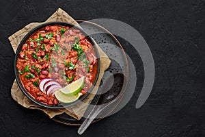 Rajma Masala Curry in black bowl on dark slate table top. Red Kidney Bean Dal is indian cuisine vegetarian dish