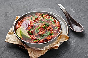 Rajma Masala Curry in black bowl on dark slate table top. Red Kidney Bean Dal is indian cuisine vegetarian dish