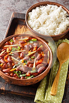 Rajma masala is a Indian vegetarian dish consisting of red kidney beans in a thick gravy with many spices served with rice close-