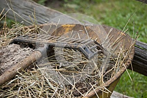 Rake on wheelbarrow