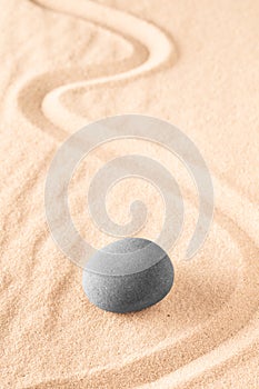 Raked sand and spa wellness healing stones