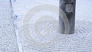 Raked white stone sand detail in Zen pebble garden