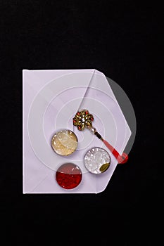 Raksha Bandhan Festival â€“ Close view of elegant Rakhi, sweets, blue gift box, and Indian currency notes with kumkum and rice