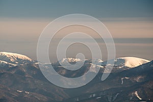 Rakytov, Cierrny kamena and Ploska in Velka Fatra mountains from Martinske hole in Mala Fatra mountains in Slovakia during winter