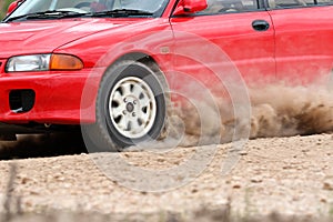 Rally car in dirt track.