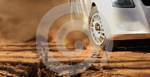 Rally race car drifting on dirt track photo