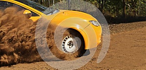 Rally race car drifting on dirt track