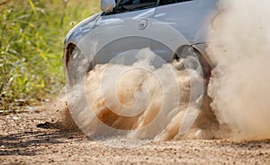 Rally race car drifting on dirt track