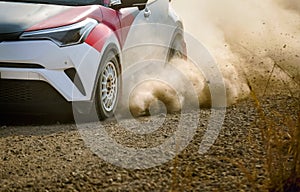 Rally racing car on dirt road