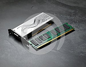 Wi-Fi card, RAM chip and computer motherboard in gray table, shutdown