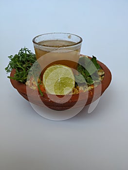 Ram Navami Hindu Festival Food Musk Melon Cool drink, Hesaru Bele with Lemon in a Sand Bowl  on White Background