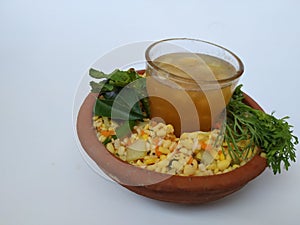 Ram Navami Hindu Festival Food Musk Melon Cool drink, Hesaru Bele with Lemon in a Sand Bowl  on White Background