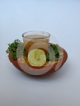 Ram Navami Hindu Festival Food Musk Melon Cool drink, Hesaru Bele with Lemon in a Sand Bowl  on White Background
