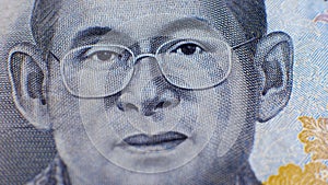 Rama IX in glasses on baht THB banknote