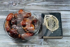 Ramadan background, Ajwa dates, a cultivar of the palm date used in iftar, The holy Quran, Qur'an or Koran