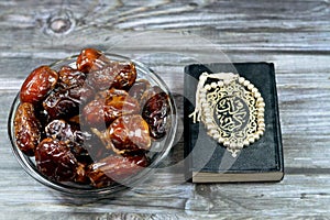 Ramadan background, Ajwa dates, a cultivar of the palm date used in iftar, The holy Quran, Qur'an or Koran