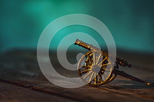 Ramadan Cannon with Colorful Light Glowing at Night and Glittering with Bokeh Lights on Ground. Festive Greeting Card, Invitation