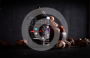 Ramadan concept. Dates in the foreground on black background- Image