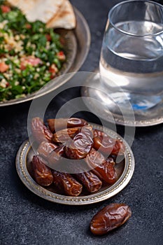 Ramadan dates, water and tabbouleh is traditional food for iftar in islamic world