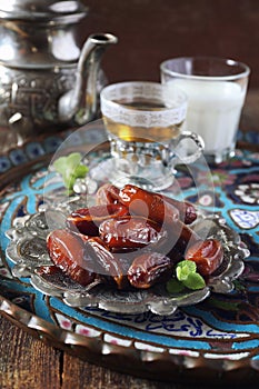 Ramadan food: ripe dates, green tea and fermented milk drink