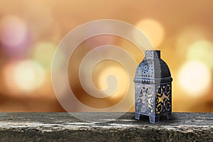 Ramadan Kareem background with Eid lamp or Arabic lantern on gold candle light bokeh for Islamic muslims religious fasting month