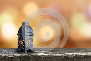 Ramadan Kareem background with Eid lamp or Arabic lantern on gold candle light bokeh for Islamic muslims religious fasting month