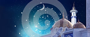 Ramadan Kareem background. Moon at a top of a mosque