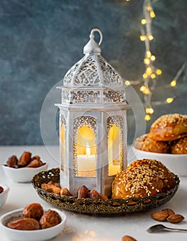 Ramadan Kareem and iftar muslim food. Holiday of Holy month of Ramadan. Dates, nuts, dried fruits and lattern with candles