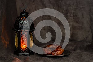 Ramadan Kareem lantern and dates fruit background.