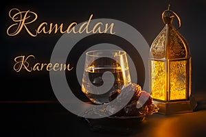 Ramadan Kareem, muslim religious tradition, holy month in Islam and Iftar concept theme with a bowl of dates, prayer beads, glass