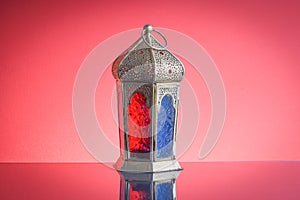 Ramadan lantern or Arabic decoration lamp on red background