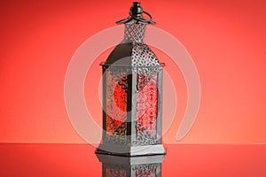 Ramadan lantern or Arabic decoration lamp on red background