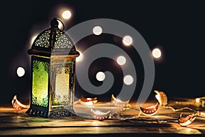 Ramadan Lantern with Colorful Light Glowing at Night and Glittering with Bokeh Lights on Ground. Festive Greeting Card, Invitation