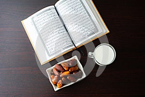 Ramadan moments dates and milk and coran iftar time  photo