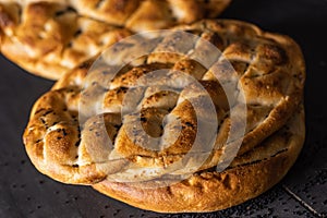Ramadan Pita Ramazan Pidesi. Traditional Turkish bread for holy month Ramadan. Dark food photograph photo