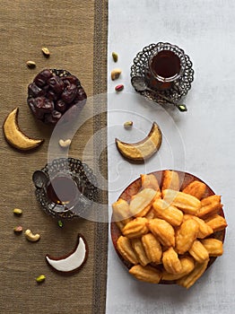 Ramadan sweets background. Cookies of El Fitr Islamic Feast. Tulumba - arabian syrup-soaked fried sponge honey