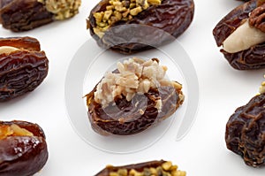 Ramadan sweets and luxurious selection of jumbo sweet dates concept with close up on medjool date stuffed with pistachio and