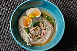 Ramen bowl with soft boiled eggs and pork belly