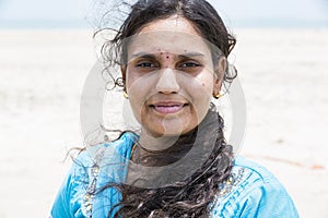 Portrait of Asian senior beautiful woman smiling wearing traditional Indian dress sari.