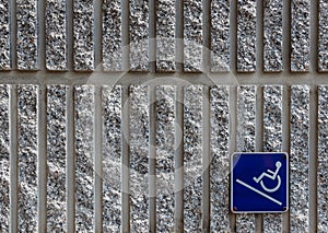 Ramp access sign on concrete wall background