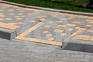 Ramp for lowering disabled persone from a pedestrian sidewalk. photo