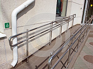 Ramp for physically challenged with metal railing