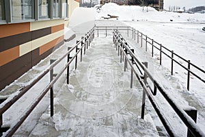 Ramp for strollers and freight carts at the entrance of a residential apartment building. Novosibirsk Russia