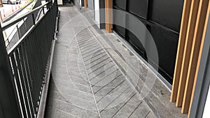 Ramp for wheelchair at the building background