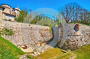 The ramparts and a moat of Castle of Brescia, Italy photo