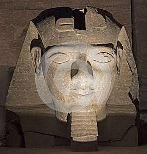 Ramses II head at Luxor Temple at night